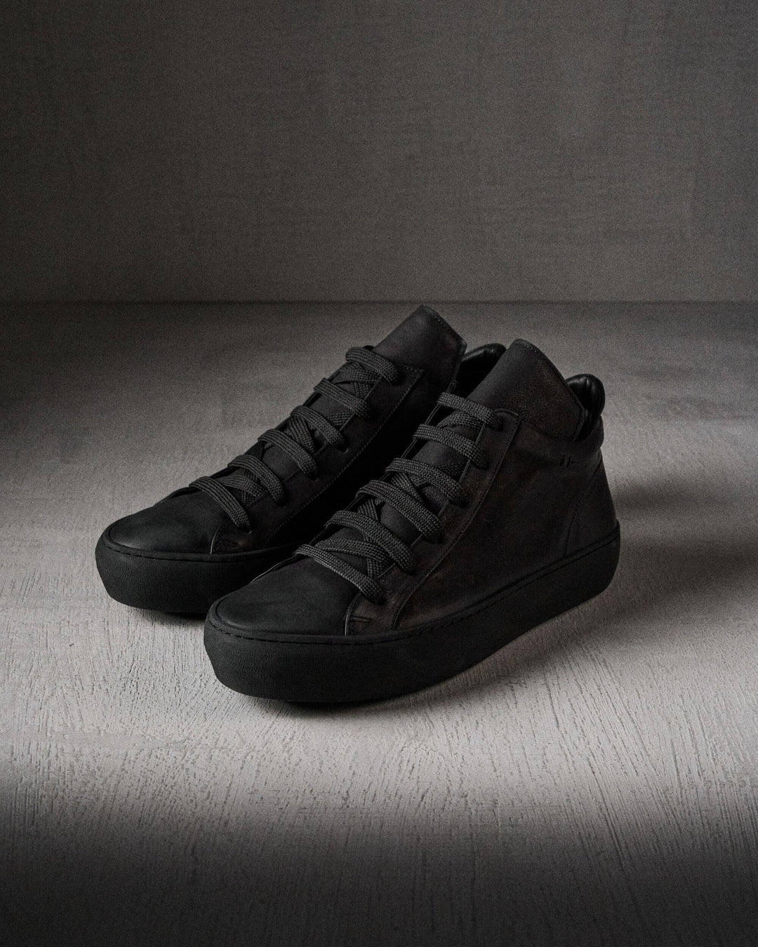 Chukki men's black leather shoe front side view